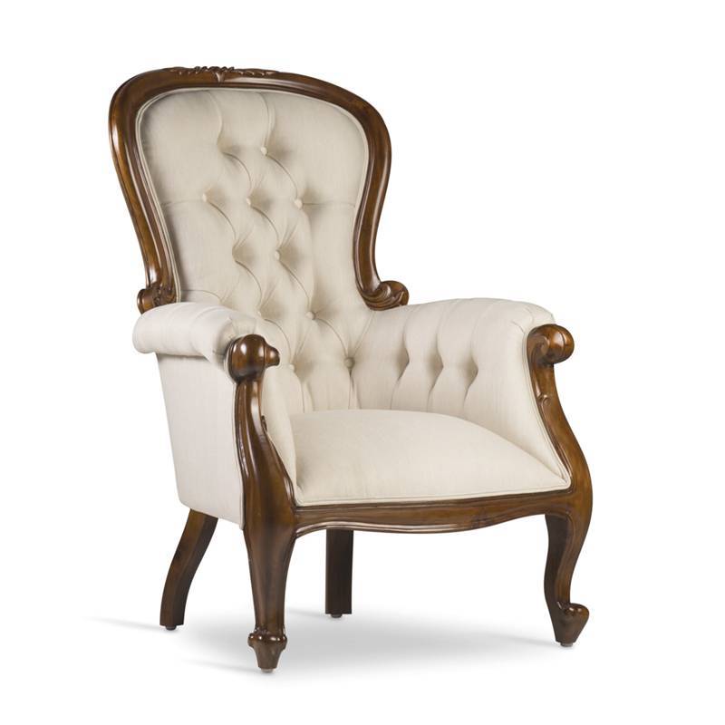 Sillón clásico modelo Grandfather, tapizado en capitoné, madera de caoba color nogal. El Tavolino